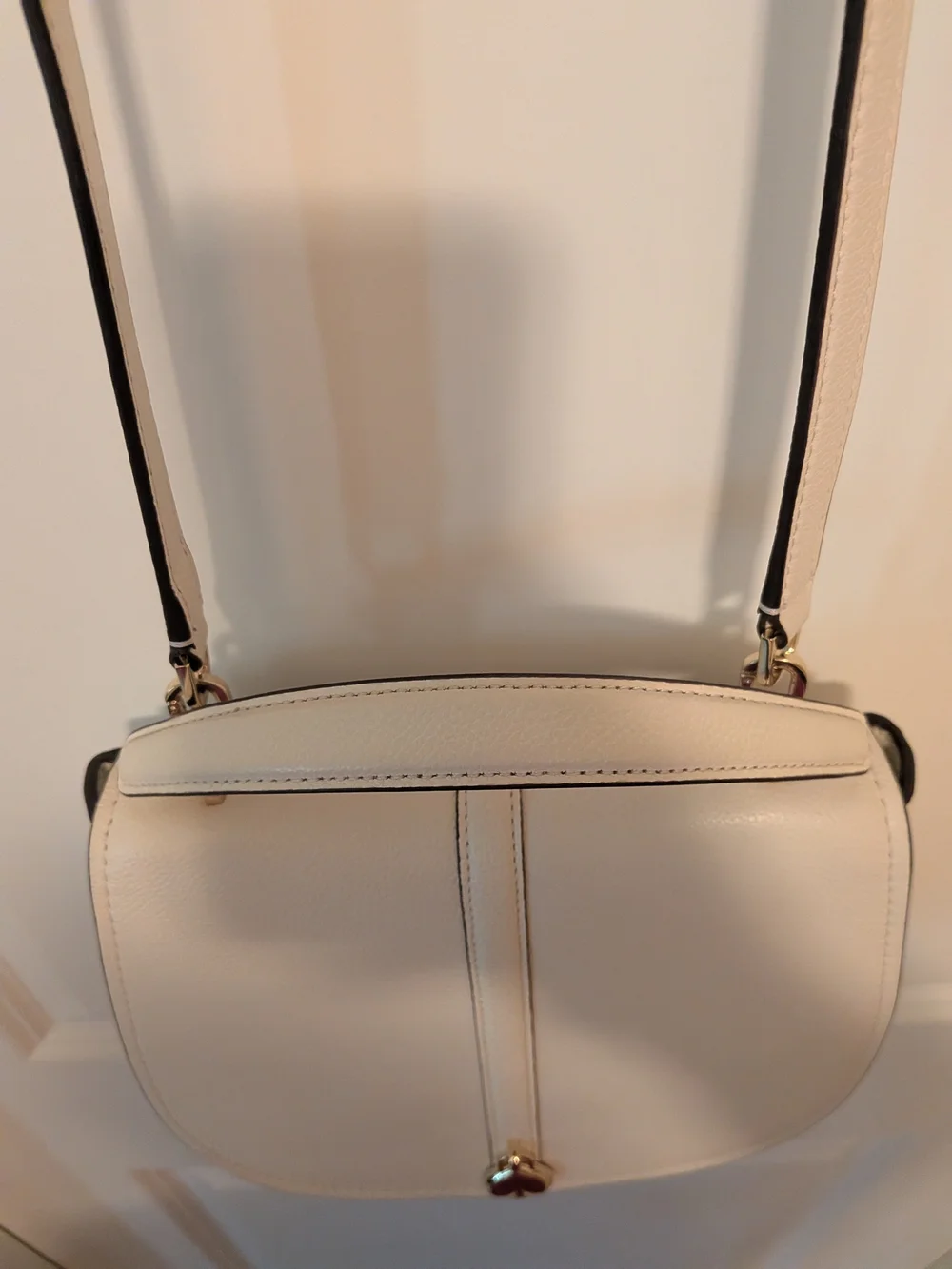 kate spade Cream Pebbled Leather Saddle Crossbody with Gold Heart Charm